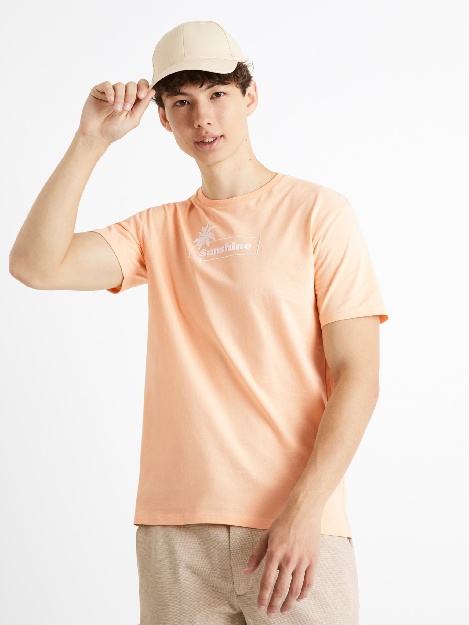 Fotografie Světle oranžové bavlněné tričko Celio Cecarto Sunshine - S
